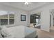 Bright bedroom with private access to the lanai, perfect for enjoying outdoor living at 7382 Se 167Th Zina Ln, The Villages, FL 32162