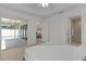 Spacious bedroom with lanai access, en-suite bathroom, and walk-in closet at 7382 Se 167Th Zina Ln, The Villages, FL 32162
