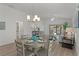 Open dining area featuring modern decor and ample space for entertaining guests at 7382 Se 167Th Zina Ln, The Villages, FL 32162