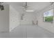 Spacious two car garage offers lots of storage, an attic access point, and an epoxy coated floor at 7382 Se 167Th Zina Ln, The Villages, FL 32162
