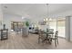 Bright, open-concept living and dining area with modern furnishings and plenty of natural light at 7382 Se 167Th Zina Ln, The Villages, FL 32162