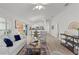 Spacious living area with open-concept design and contemporary finishes and luxury vinyl plank flooring at 7382 Se 167Th Zina Ln, The Villages, FL 32162