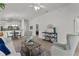 Bright living room featuring modern decor, wood floors, and an open floor plan perfect for entertaining at 7382 Se 167Th Zina Ln, The Villages, FL 32162