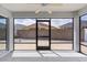 Relax on the screened patio overlooking the private backyard, featuring a ceiling fan for added comfort at 7382 Se 167Th Zina Ln, The Villages, FL 32162