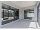 The covered, screened patio opens to the backyard through sliding glass doors and provides lots of space at 7382 Se 167Th Zina Ln, The Villages, FL 32162