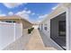 This property features a gravel side yard with a partial view of the rear patio at 7382 Se 167Th Zina Ln, The Villages, FL 32162