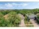 Aerial view of house showing property lines, roofs, driveways, lawns and lush landscaping at 791 Wolf Creek St, Clermont, FL 34711