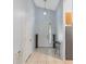 Bright foyer features tile flooring, a stylish front door with glass accent, and ample space leading to the kitchen at 791 Wolf Creek St, Clermont, FL 34711