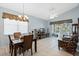 Bright living room boasts tile floors, vaulted ceilings, and sliding glass doors to the screened patio at 791 Wolf Creek St, Clermont, FL 34711
