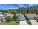 Lovely single-story home with well-manicured lawn, mature trees, and attached two-car garage at 830 Grand Vista Trl, Leesburg, FL 34748