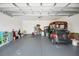 Spacious garage with a golf cart and room for storage and parking at 830 Grand Vista Trl, Leesburg, FL 34748