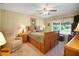 Cozy main bedroom with a sleigh bed, side tables, and lots of drawer space for storage at 830 Grand Vista Trl, Leesburg, FL 34748