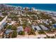 A captivating aerial view of a beachfront community, highlighting the neighborhood's proximity to the ocean at 910 Locust St, New Smyrna Beach, FL 32169