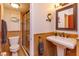 Elegant bathroom features a glass shower, pedestal sink, and stylish finishes at 910 Locust St, New Smyrna Beach, FL 32169