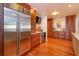 Bright kitchen featuring stainless steel appliances and wooden cabinets at 910 Locust St, New Smyrna Beach, FL 32169