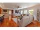 Open-concept living room with comfortable seating, modern decor, and natural light at 910 Locust St, New Smyrna Beach, FL 32169
