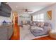 Cozy living room featuring a large sectional sofa, hardwood floors, and coastal-themed decor at 910 Locust St, New Smyrna Beach, FL 32169
