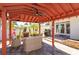 Inviting cabana with comfortable seating, fireplace, and outdoor grill perfect for entertaining at 910 Locust St, New Smyrna Beach, FL 32169