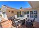 Outdoor patio featuring a cozy seating arrangement, perfect for relaxing and enjoying the serene surroundings at 910 Locust St, New Smyrna Beach, FL 32169