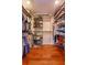 Organized walk-in closet with ample shelving and hanging space for clothing and shoes at 910 Locust St, New Smyrna Beach, FL 32169