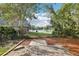 Secluded backyard with brick patio and beautiful lake views, perfect for relaxing and entertaining outdoors at 981 Piedmont Oaks Dr, Apopka, FL 32703