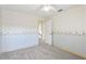 Bright bedroom featuring patterned wallpaper and ceiling fan at 981 Piedmont Oaks Dr, Apopka, FL 32703