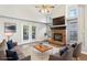 Bright living room with fireplace, vaulted ceiling, french doors and neutral decor at 981 Piedmont Oaks Dr, Apopka, FL 32703
