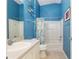 Bathroom featuring vanity, toilet, bathtub and shower combination with decorative elements at 992 Pinewood Pl, The Villages, FL 32162