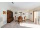 Bright dining area with white walls and a sliding door leading to the outside at 992 Pinewood Pl, The Villages, FL 32162