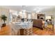 Cozy dining area with hardwood floors, seamlessly connected to the living room and kitchen at 1037 Willow Dr, Leesburg, FL 34748