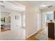 Bright hallway with tile flooring connecting different areas of the home at 1037 Willow Dr, Leesburg, FL 34748