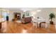 Open living space featuring hardwood floors and a dining area, perfect for entertaining at 1037 Willow Dr, Leesburg, FL 34748