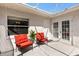 Charming patio area featuring comfortable seating, offering a relaxing outdoor space with privacy at 1037 Willow Dr, Leesburg, FL 34748