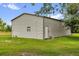 Exterior of metal barn with grassy yard at 10901 Island Grove Rd, Clermont, FL 34711