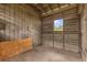 Barn interior with wood walls and open-air slats for ventilation at 10901 Island Grove Rd, Clermont, FL 34711