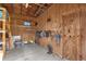 Barn interior with plywood walls and storage at 10901 Island Grove Rd, Clermont, FL 34711