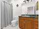 Bathroom featuring wood vanity and tiled floors at 10901 Island Grove Rd, Clermont, FL 34711