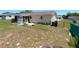 Aerial backyard view of home, featuring garden, grass, and patio at 11250 Sw 78Th Ct, Ocala, FL 34476