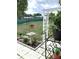 Backyard patio area with a small garden plot with a birdbath at 11250 Sw 78Th Ct, Ocala, FL 34476