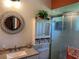Bright bathroom featuring a shower, beadboard walls, granite countertop, and modern fixtures at 11250 Sw 78Th Ct, Ocala, FL 34476