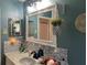 Tastefully decorated bathroom with granite countertop, large vanity mirror, and modern fixtures at 11250 Sw 78Th Ct, Ocala, FL 34476
