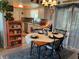 Inviting dining area with a table set for four and a view of the kitchen at 11250 Sw 78Th Ct, Ocala, FL 34476