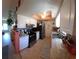 Bright kitchen featuring white cabinets, stainless steel appliances, and stylish backsplash, with a skylight overhead at 11250 Sw 78Th Ct, Ocala, FL 34476