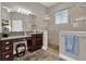 Bathroom featuring a walk-in shower, granite countertops, and ceramic tile floors at 1172 Fiesta Key Cir, Lady Lake, FL 32159