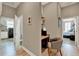 Hallway view showcasing a small desk nook and the entrance to both the laundry room and a bedroom at 1172 Fiesta Key Cir, Lady Lake, FL 32159