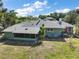 Aerial view showcasing the large backyard, screened in porch, and beautiful trees at 1313 Crestview Dr, Mount Dora, FL 32757