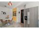 Eat-in kitchen features white wainscoting, a stainless steel refrigerator, and retro orange accents at 1313 Crestview Dr, Mount Dora, FL 32757