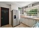 Functional kitchen featuring stainless steel appliances, wooden countertops, and ample storage space at 1313 Crestview Dr, Mount Dora, FL 32757