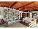 Comfortable living room highlighting wood ceiling, built-in bookshelves, and a cozy seating area at 1313 Crestview Dr, Mount Dora, FL 32757