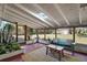 Relaxing sunroom with views of the expansive backyard and mature trees at 1313 Crestview Dr, Mount Dora, FL 32757
